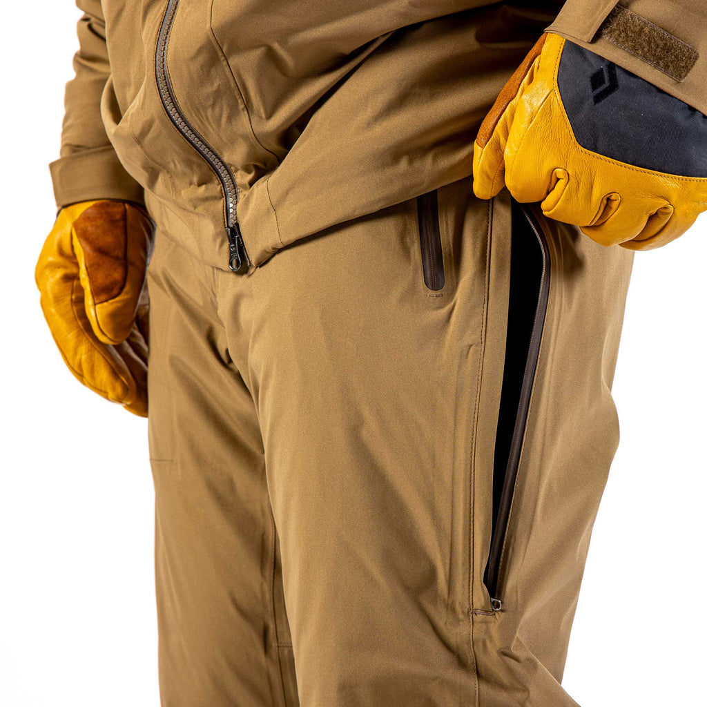 Men's Ezo Insulated Pant in Khaki, side view close up of the thigh vent